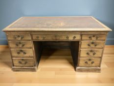 A late Victorian twin pedestal pollard oak nine drawer writing desk, 150 cm x 83 cm x 76 cm.