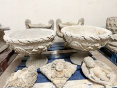 A pair of concrete garden planters, diameter 54 cm.