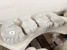 Twelve concrete garden feet stones, length 26 cm.