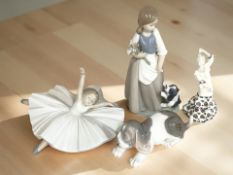 A Lladro puppy, a Nao ballerina, further figure of a girl with dog,