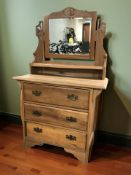 An Edwardian satin walnut mirror back dressing chest, 91 cm x 43 cm x 150 cm.