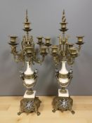 A pair of ornate reproduction gilt metal mounted candelabra, height 67 cm.