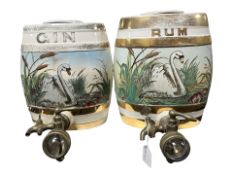 Two ceramic spirit barrels with brass taps, height 28 cm.