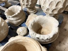 A pair of concrete garden sack planters, height 24 cm.