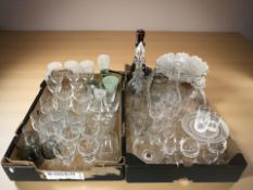 A collection of drinking glasses including etched examples, a ruby glass decanter,