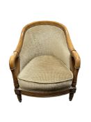 A reproduction tub armchair, width 64 cm.