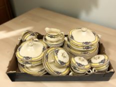 A quantity of Wedgwood & Co dinner china decorated with floral baskets.