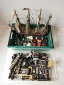 A group of die cast metal Napoleonic soldiers, Tri-Ang rolling stock, die cast cars,