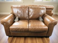 An Italsofa stitched chesnut brown leather two seater settee, with removable wooden feet,