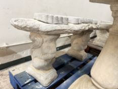 A rustic concrete garden bench on squirrel supports, width 100 cm.