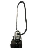 An Oreck vacuum cleaner and a Roberts radio