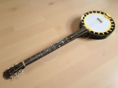 A very large novelty shop display six string banjo, approximately 255 cm long.