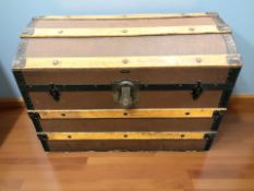 An early 20th century Drawco patent canvas metal and wooden bound dome topped trunk, width 76 cm.