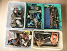 A large quantity of unboxed hand and power tools.