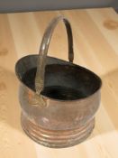 A Victorian copper coal helmet, height 36 cm including handle.