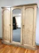 A late Victorian ash triple door compactum wardrobe, 190 cm x 63 cm x 199 cm.