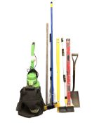 An electric garden blower vacuum and a group of tools