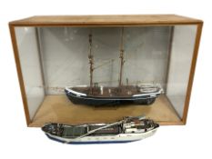 A wooden scale model of a sailing yacht in glazed display case, 78 cm x 32 cm x 52 cm,