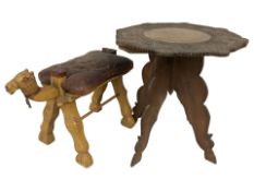An Indian carved hardwood octagonal occasional table on collapsible support, height 52 cm,