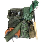 A quantity of fishing equipment including bags, rods,