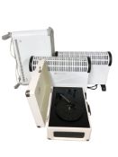 Three electric heaters and a record player