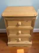 A modern pine three drawer bedside chest, width 46 cm.