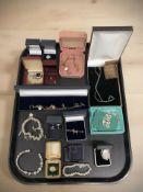 A collection of jewellery including silver items, several charm bracelets, dress rings, dog brooch,