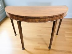 A late Victorian mahogany demi-lune console table in the George III style, 126 cm x 62 cm x 78 cm.