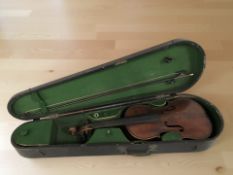 An early 20th violin, labelled inside Medio-Fino, with one-piece 13 inch back,