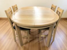 A modern oak oval extending table with fold away leaf, extended 160 cm x 115 cm x 76 cm,