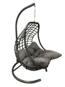 A Chelsea Garden Company metal and woven plastic hanging garden seat with cushion,