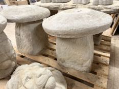 A pair of concrete garden staddle stones, height 40 cm.