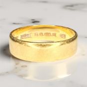 A 22ct gold band ring, size L CONDITION REPORT: 4.