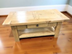 A modern oak two tier rectangular coffee table fitted a drawer, 120 cm x 60 cm x 50 cm.