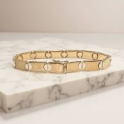A 9ct gold segmented bracelet, length 18.5cm. CONDITION REPORT: 13.