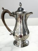 A George III silver coffee pot, John Langlands I, Newcastle 1769, engraved with a family crest,