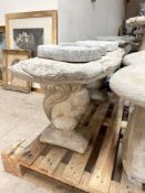 A rustic concrete garden bench on squirrel supports, width 100 cm.