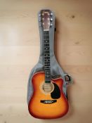 An Encore electro acoustic guitar, with carry bag.