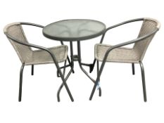 A metal glass topped patio table, diameter 60 cm,