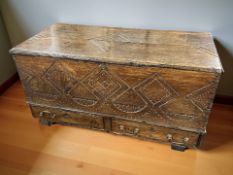 A George III carved oak and pine blanket chest, 123 cm x 58 cm x 63 cm.