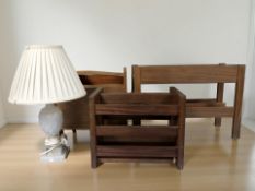 Three retro teak magazine racks and a carved alabaster table lamp.