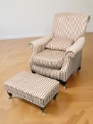 A Victorian style armchair and matching rectangular footstool retailed by Chapmans,