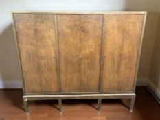 A 20th century Scandinavian triple door side cabinet, 153 cm x 45 cm x 139 cm.