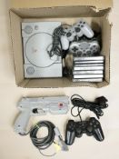 A Sony Playstation 1, controllers, several games and a pistol.