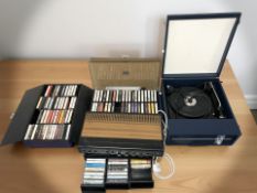 A Fidelity turntable, three cases of cassette tapes and a vintage amplifier.