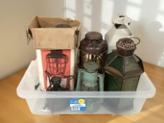 A Tilley lamp and several other lamps and lanterns.