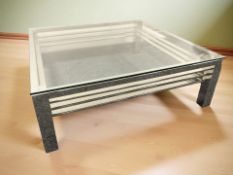 A contemporary chrome and glass square low coffee table, 100 cm W x 34 cm H.