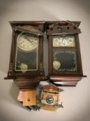 Two reproduction wall clocks and a cuckoo clock.