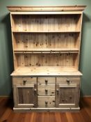 A modern pine kitchen dresser, 133 cm x 48 cm x 199 cm.