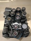 A Praktica BCA camera body, Minolta XG 2 camera and a Vivitar V3000 camera body,